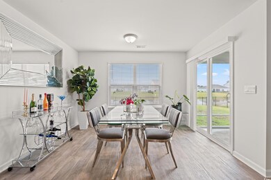 Dining area featuring healthy amount of natural light and wood finished floors