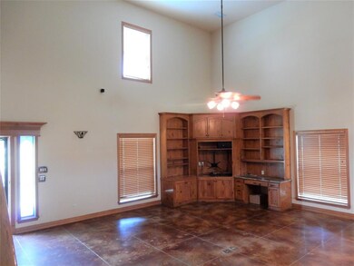 Large open living area with 2-story ceiling, built