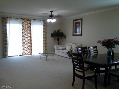 Large living area with sliders to the pool