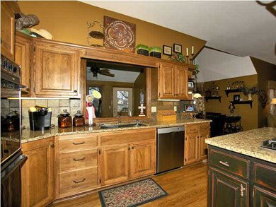 Kitchen has double ovens and desk