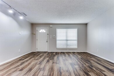 Entryway with dark hardwood / wood-style flooring,