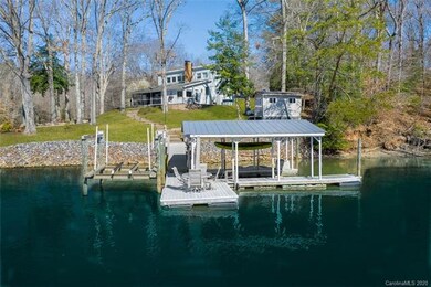 Double jet ski ports, boat lift, covered slip and floating pier