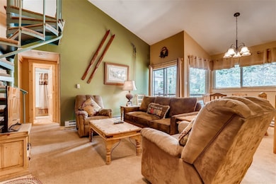 Living room with a baseboard radiator, light color
