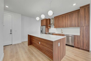 Kitchen featuring appliances with stainless steel
