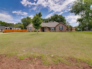 Single story home featuring brick siding