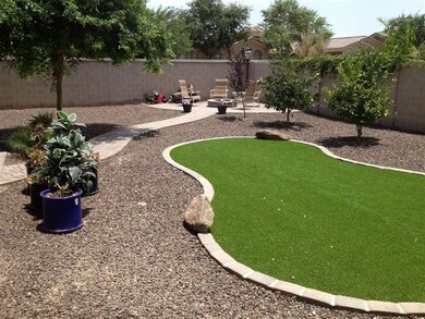 synthetic grass and path to firepit area