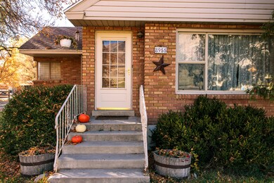 Doorway to property with brick siding