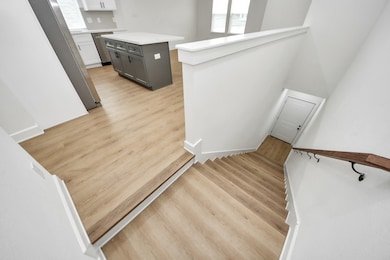 This stairwell offers a refined entryway that flow