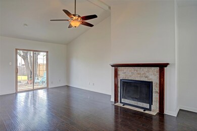 Unfurnished living room with high vaulted ceiling,