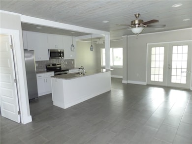 Great room looking into kitchen and dining area. B