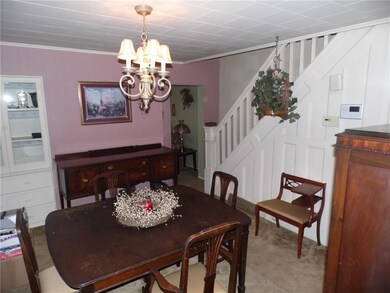 A formal dining room has a built in china cupboard