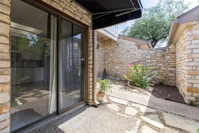 Entrance to property with stone siding