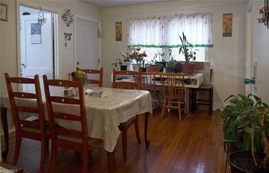 Beautiful hardwoods extend through the huge dining room! Kitchen to the left and master bedroom to the right.