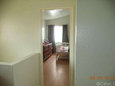 Hallway upstairs, leading to the bedroom.