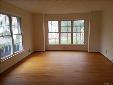 HARDWOOD FLOORING ENHANCES THIS SPACIOUS 19' X 13'