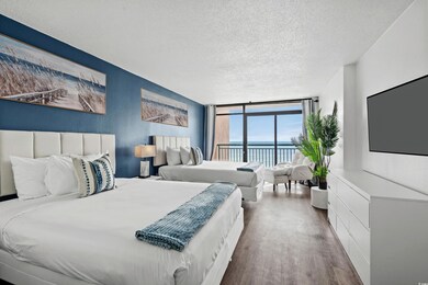 Bedroom with floor to ceiling windows, wood-type f