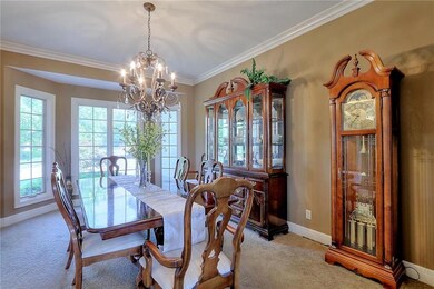 FORMAL DINING ROOM WITH LOTS OF NATURAL LIGHT.