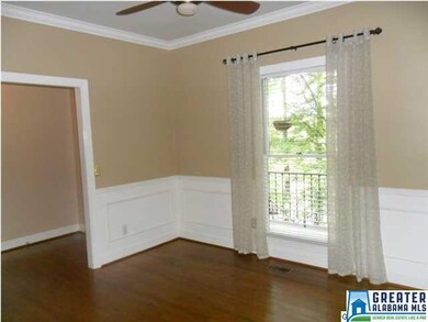 Formal dining room, with wainscoting and crown mol