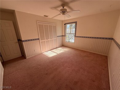 Unfurnished bedroom with wainscoting, a closet, ca
