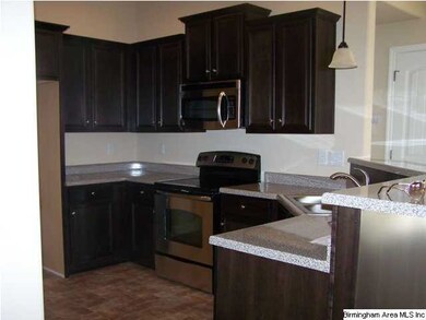Beautiful open kitchen with ebony cabinets, and la