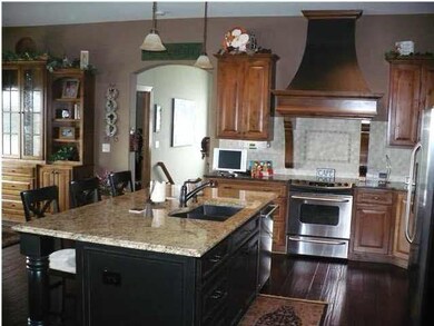 KITCHEN HAS GRANITE WITH STAINLESS STEEL APPLIANCE