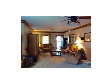 Living room has crown molding and is very spacious