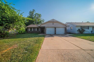 Ranch-style house featuring a garage and a front l