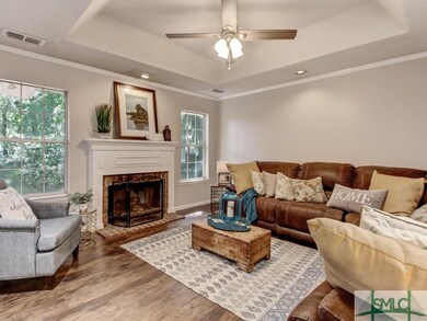 neutral family room opens to the kitchen and casua