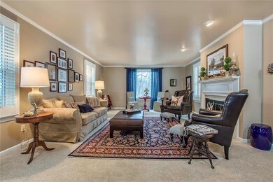 Living Room with Crown Molding, Spotlights and a G