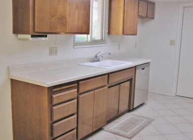 MORE CABINETS PLUS A WINDOW AT THE SINK