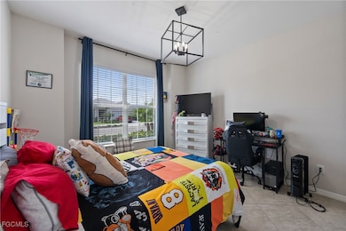 Bedroom with an inviting chandelier