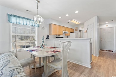 Dining room featuring light wood-style flooring, a