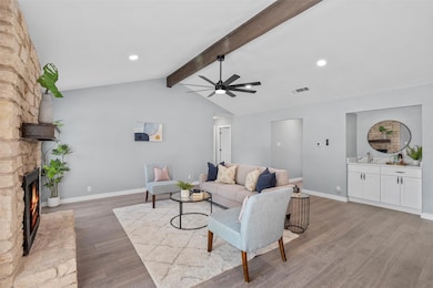 Living room featuring light wood-style flooring, 
