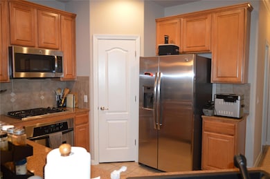 Kitchen featuring appliances with stainless steel