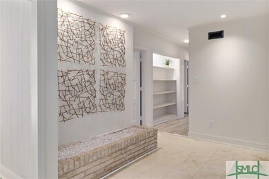 Foyer with marble flooring leading into main home.