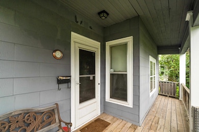 Entrance to property featuring a porch