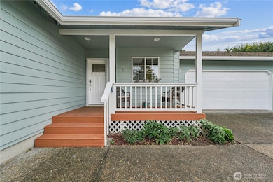 Covered front porch entry.  The exterior has just been painted.