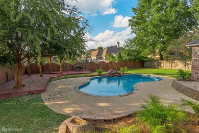 View of pool featuring a lawn and a patio area
