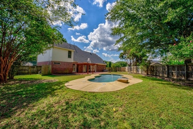 View of swimming pool featuring a lawn and a patio