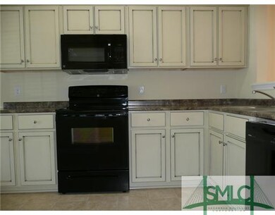Kitchen. PHOTOS ARE FROM SIMILAR TOWNHOMES BY THE 