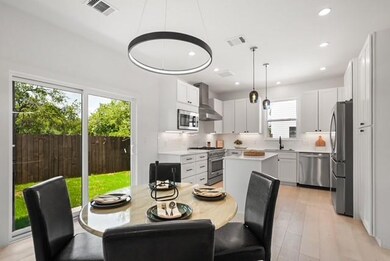 Dining room featuring light wood-style flooring and recessed lighting