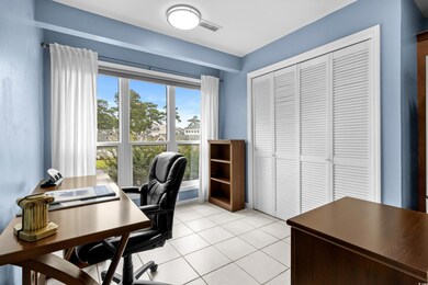Home office with light tile patterned flooring