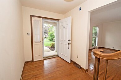Inviting entry with beautiful hardwood floors.