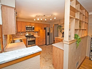The Stylish Kitchen with Maple Cabinets and Stainl