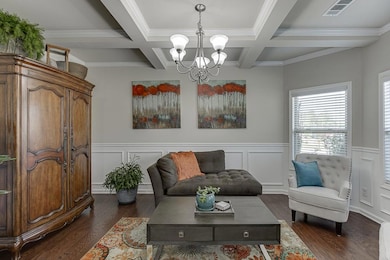 Living area with dark wood-style floors, a notable