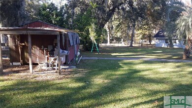 Pool pump, storage shed & portion of back yard