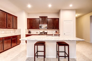 The large granite island offers a great space for