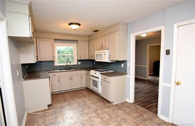 Kitchen with granite countertops, updated cabinets