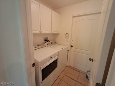 Laundry room featuring washing machine and dryer,
