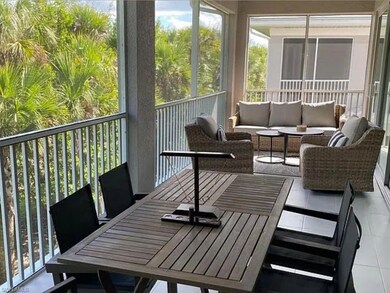 Sunroom / solarium with outdoor dining area and an